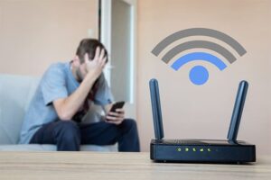 An image featuring a person and a Wi-Fi router with low signal